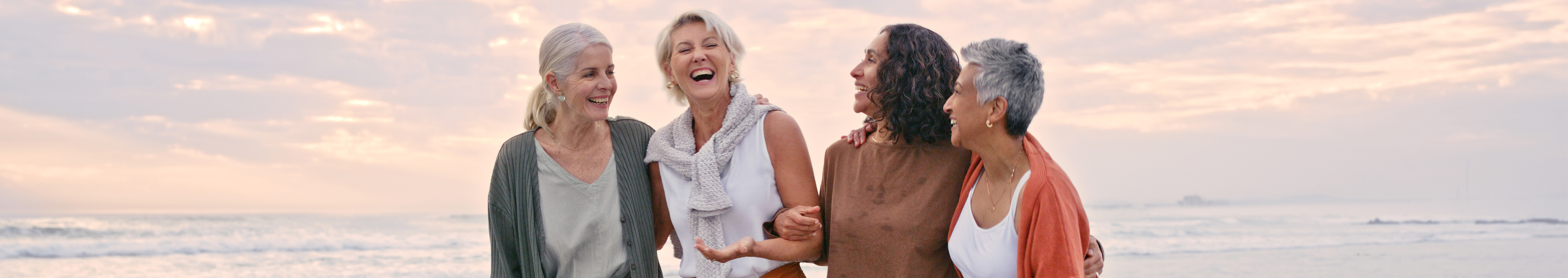 Elderly women friends laughing.