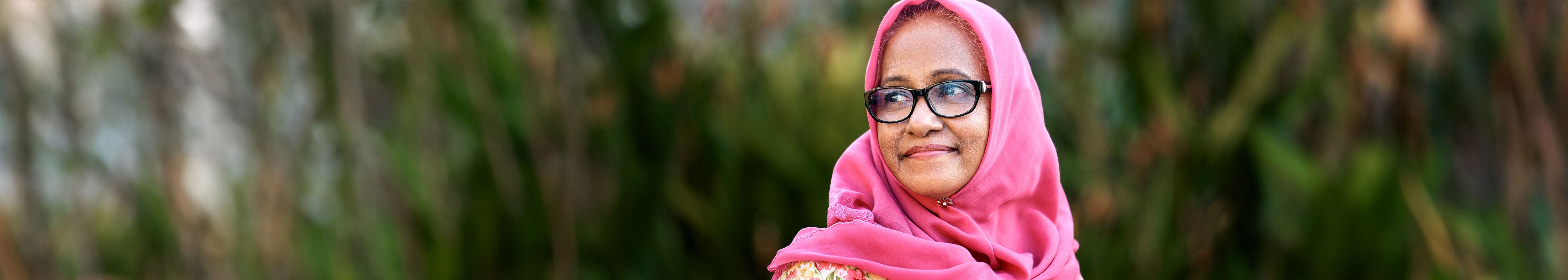 Multicultural women with a pink scarf covering her head