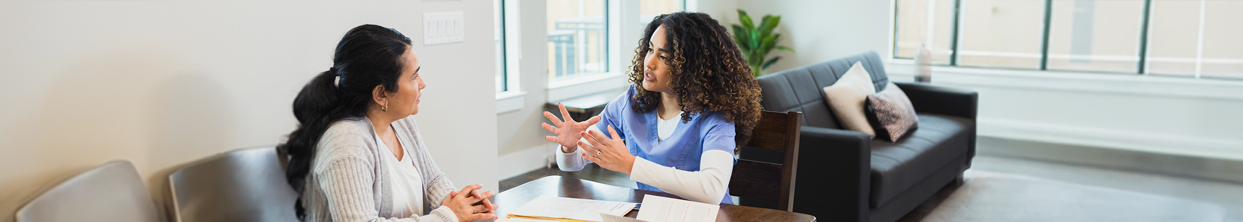 A doctor consulting a patient in her room.