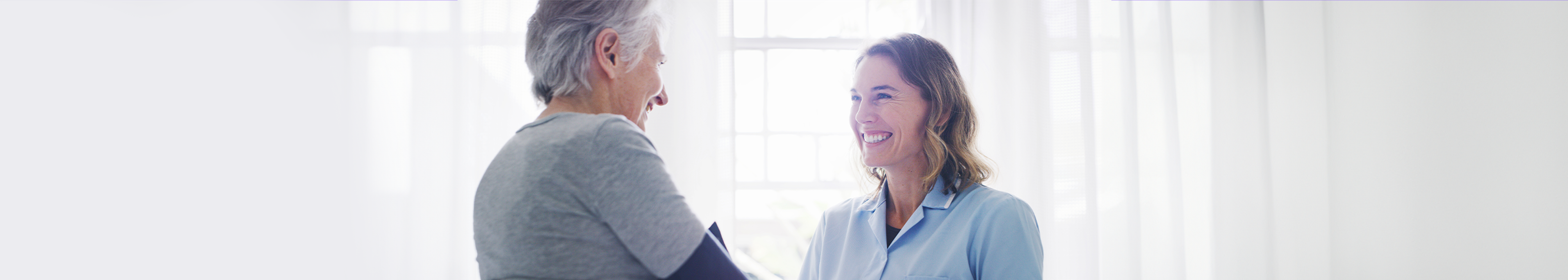 Two happy women after their breast screening appointment